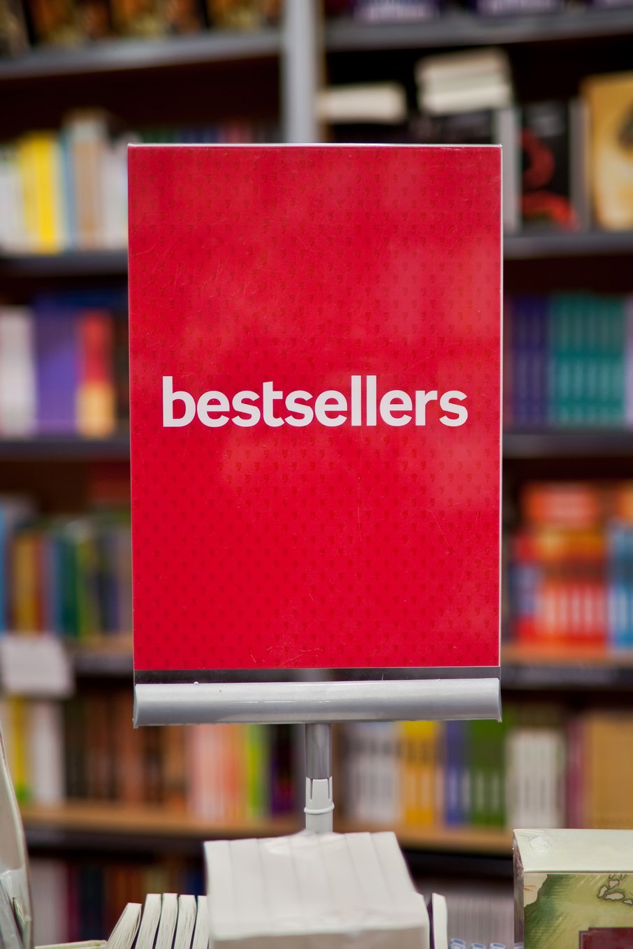 A bestsellers sign on a display in a bookstore